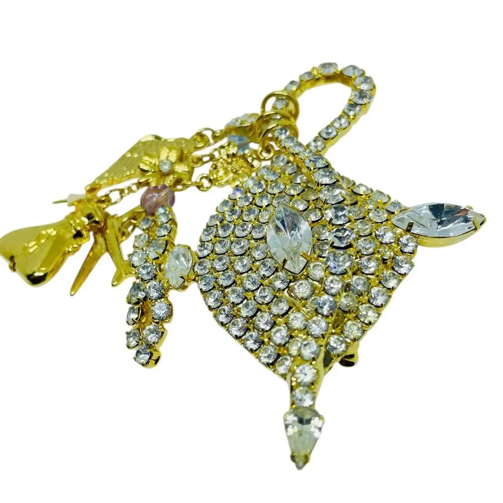 KIRKS FOLLY signed gold tone rhinestone Aladdin lamp designer brooch